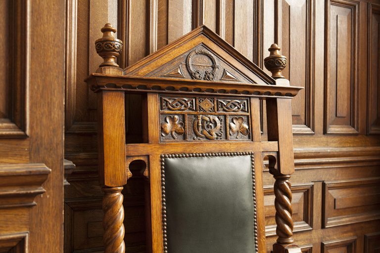 A picture of an ornate wooden chair.